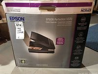 Epson Perfection V370 scanner in original box showing front panel and product branding including 4800 dpi resolution.