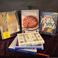 Six cookbooks arranged with covers visible, including Platters and Boards, Dessert Person, Perfect Preserves, Start Simple, Rosie's All Butter Baking Book, Fried Chicken & Champagne.
