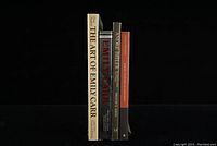 Four Canadian art books standing upright showing spines and front covers, titles visible for identification