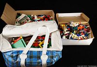 Canvas bag and cardboard box containing bulk LEGO bricks