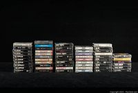 Full front view of all cassette tapes stacked in groups by artist: Led Zeppelin, Pink Floyd, Deep Purple, Rush, AC/DC, and Alice Cooper.