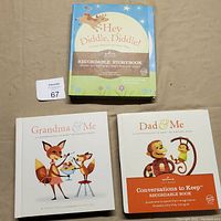 Three recordable storybooks stacked with visible covers and titles, showing colorful illustrations for children.