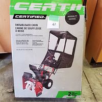 Photo of the Centip Certified Snowblower Cabin packaging showing the product on a 2-stage snowblower and key features.