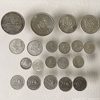 Photo showing entire coin collection with silver dollars, half dollars, quarters, dimes, and nickels.