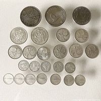 All Canadian coins arranged and displayed showing various denominations and years.