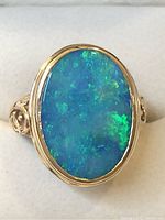 Front view of oval boulder opal face