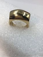 Front oblique view of ring showing dome profile and polished finish