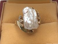 Top view of ring in box showing keshi pearl and bypass shank