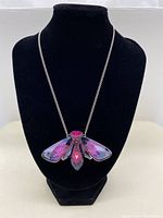 Pendant displayed on black bust to show full necklace length and design