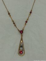 Front view of entire necklace showing chain, stones and pendant