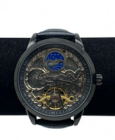Front view of watch face showing skeleton dial with exposed jeweled perpetual movement and blue moon phase indicator.