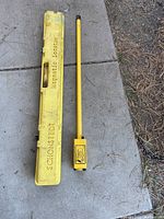 Locator and case positioned side by side on concrete