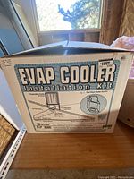 Box with product label EVAP COOLER Installation Kit including schematic diagram and price tag