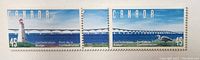 Close-up photo of three Canadian stamps featuring the Confederation Bridge in blue skies and water, each with 45 cent denomination and 'Canada' label.