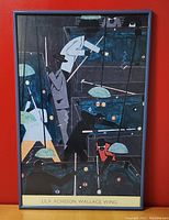 Front side of framed "Pool Parlor" poster by Jacob Lawrence showing stylized pool players in dark tones with accent colors, framed in black with text at bottom.