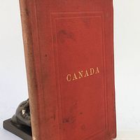 Front cover of the red hardcover book titled CANADA, showing some wear and stains