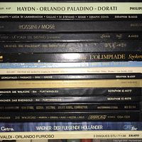 Photo of the spines of various classical music LPs featuring Haydn, Rossini, Verdi, Wagner, and others, showing label details and conductor names.