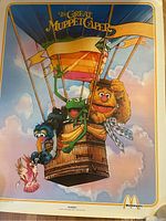 Poster showing Muppets Kermit, Fozzie Bear and Gonzo in hot air balloon with title 'The Great Muppet Caper' and McDonald's logo.