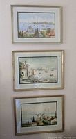 Three vertically stacked framed watercolor paintings of Istanbul showing mosques and harbor scenes