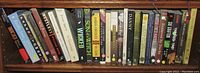 Shelf of 11 books including 'Paper Towns' by John Green, 'Wicked' by Gregory Maguire, 'Danny' by Richard Lange, and others.