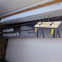 Photo of foldable workbench box front showing product image and features.