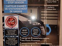 Box front displaying the garage parking stop sensor with 5-inch flashing lights, adjustable 53.5" height, and bilingual English/French text describing features.