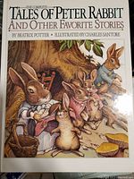 Cover of The Complete Tales of Peter Rabbit and Other Favorite Stories, showing rabbit illustrations in period clothing by Charles Santore