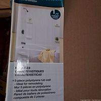 Photo of box panel showing tub surround setup with shelves and space for shower fixtures.