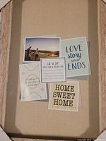 Front view of the white washed shadow box frame with placeholder decorative inserts and size label.