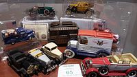 Photo showing entire lot with 6 diecast vintage cars and an ERTL Ford Model AA bank with key in back right corner