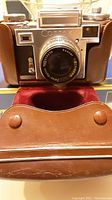 Front view of Contax camera showing Zeiss Opton Sonnar lens and leather case.