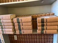 Shelves filled with beige hardcover bound volumes of Ontario Reports spanning 1931 to 1962, showing gold and black spine labels with years distinctly marked.