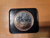 Reverse side of the 1978 Canadian silver dollar coin featuring the Edmonton Commonwealth Games emblem with athletic figures, within a black protective case.