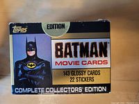 Front and top view of unopened 1989 Topps Batman Movie Cards Series 1 factory set box, with label highlighting 143 glossy cards and 22 stickers.