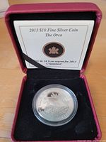 2013 $10 fine silver coin The Orca displayed in red presentation case with certificate.