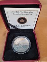 2013 $10 Fine Silver Coin in display case with certificate card visible.