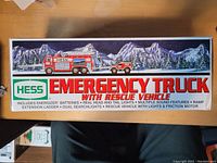 Top of the box showing the Hess Emergency Truck with Rescue Vehicle text and illustration of the two vehicles against a mountainous backdrop.
