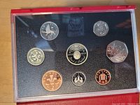 Full view of the 1994 United Kingdom proof coin set in original packaging with coins arranged on black foam insert.