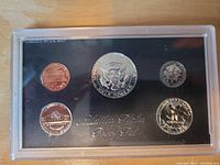 Front side of the 1969 United States proof coin set in original black display case with six coins visible.