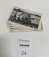 Stack of 10 black and white WWII postcards with visible numbering and photo credits