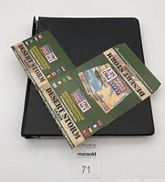 Three black ring binders with Desert Storm trading card promotional inserts, showing brand and item.