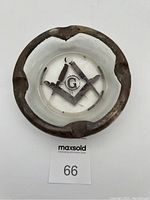 Top view of heavy glass ashtray showing etched Masonic symbol