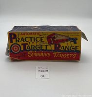 Original worn cardboard box with colorful vintage graphics and text of the Marx Automatic Practice Target Range toy.