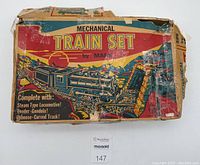 Original worn and torn Marx Mechanical Train Set box with colorful artwork and title.