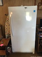 Full front view of freezer showing single door and integrated handle