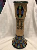 Front view showing overall shape and embossed decorative elements.