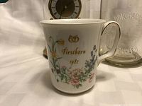 Royal Albert bone china mug with floral design and 'Firstborn 1982' inscription