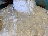 View of antique lace gown and knit shawl together showing texture and length