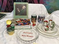 Overall lot showing embroidery threads, measuring spoons, salt & pepper shakers, pencils sharpener, mugs, glass dishes, and ashtray.