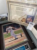 Virgil Hill signed card, certificate of authenticity, and signed Dan Uggla photo arranged together.